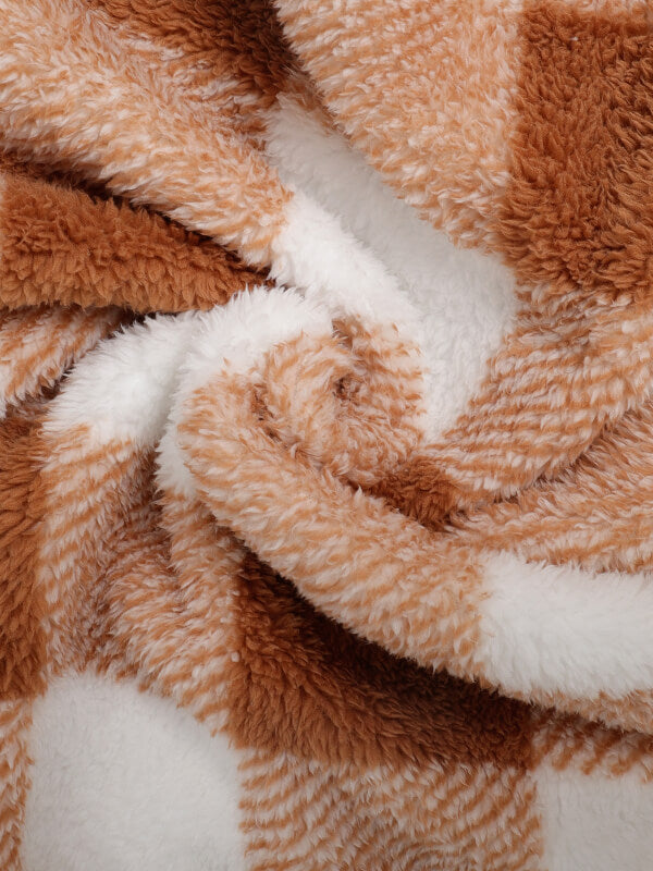 Classic men's plaid jacket with plush faux fur shoulder details, single pocket, buttons, and collar lapel