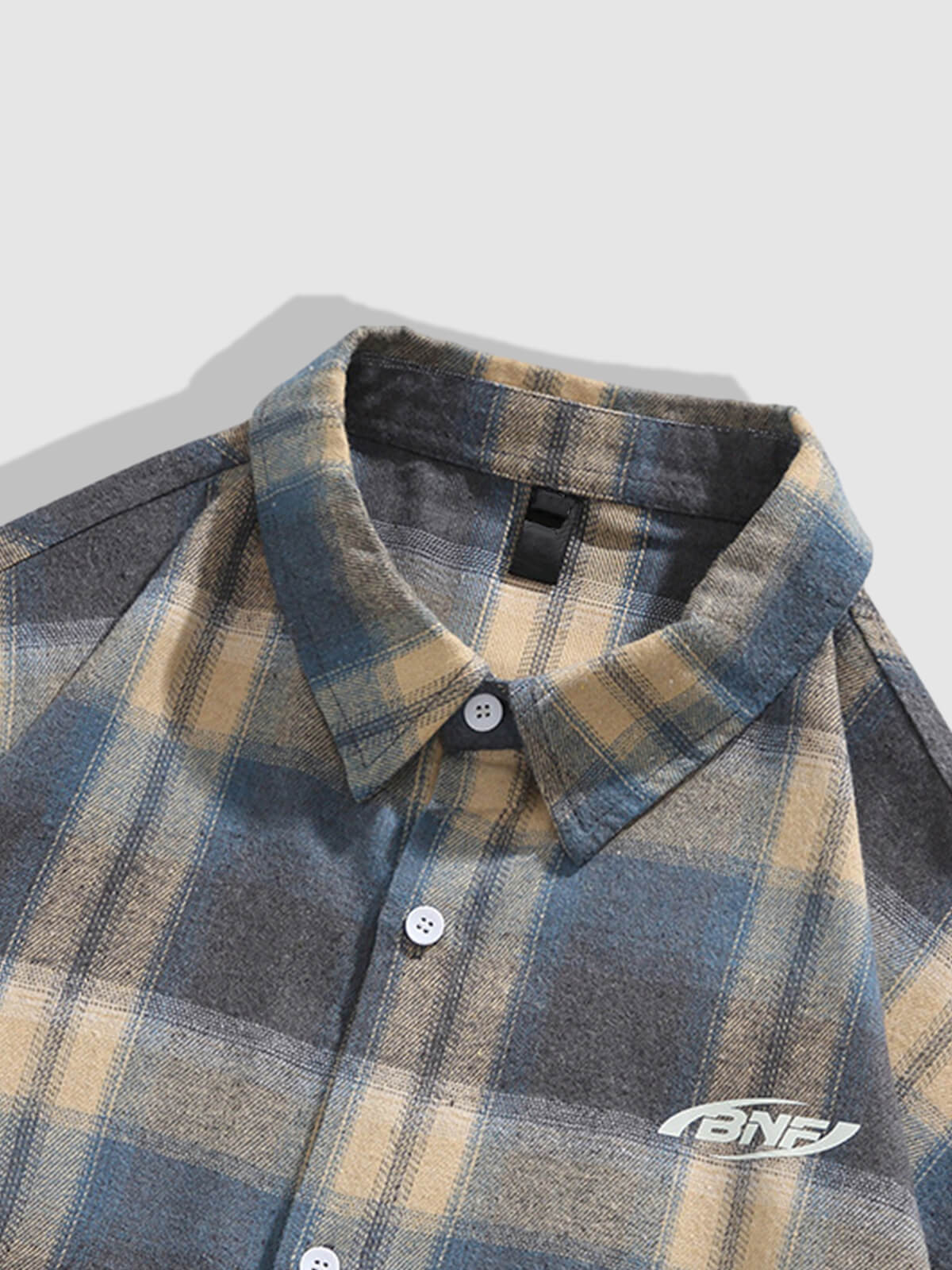 Casual men's plaid wool and cotton shirt with buttons and long sleeves