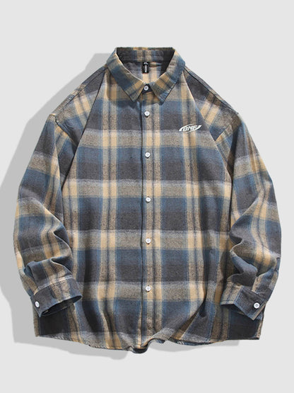 Casual men's plaid wool and cotton shirt with buttons and long sleeves