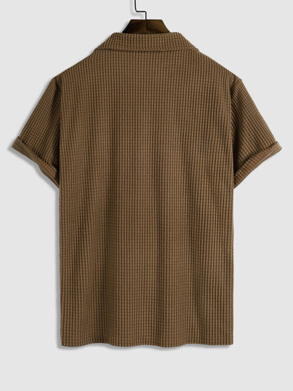 Men's polo shirt with a plain plaid pattern, textured collar, and short sleeves