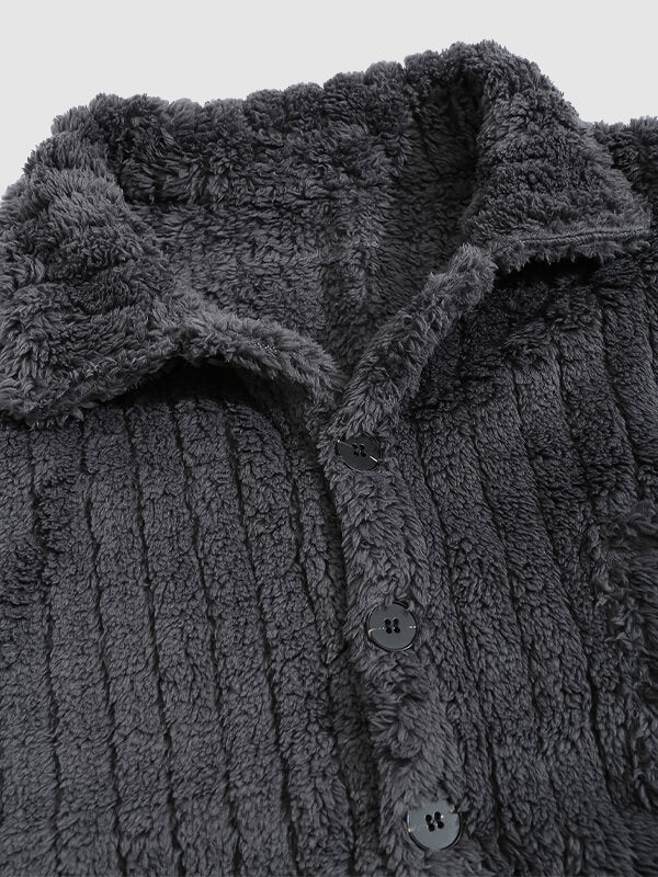 Classic men's plaid jacket with plush faux fur shoulder details, single pocket, buttons, and collar lapel