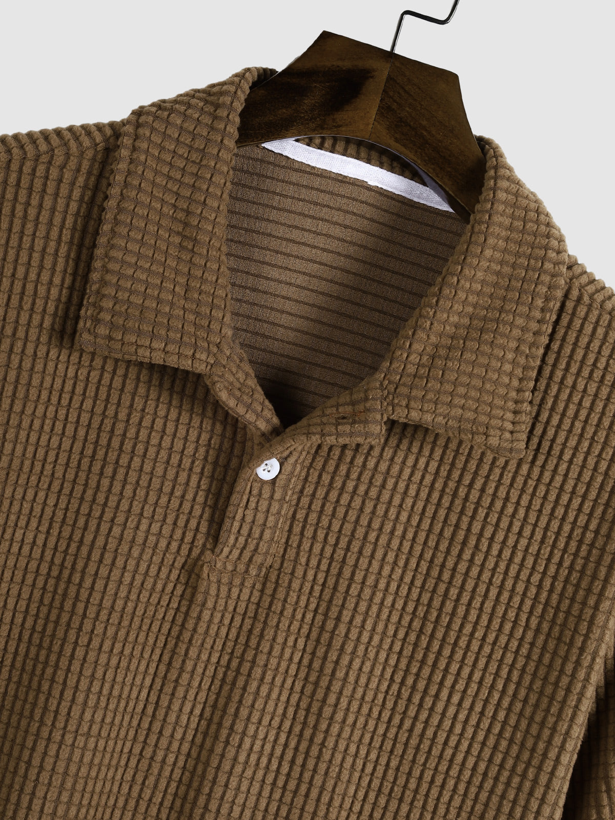 Men's polo shirt with a plain plaid pattern, textured collar, and short sleeves