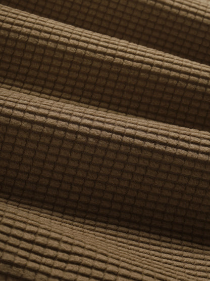 Men's polo shirt with a plain plaid pattern, textured collar, and short sleeves