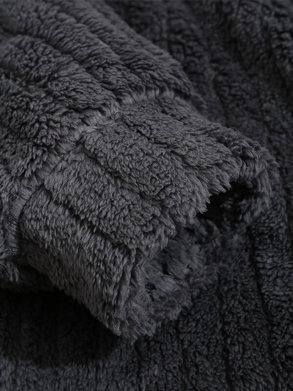 Classic men's plaid jacket with plush faux fur shoulder details, single pocket, buttons, and collar lapel