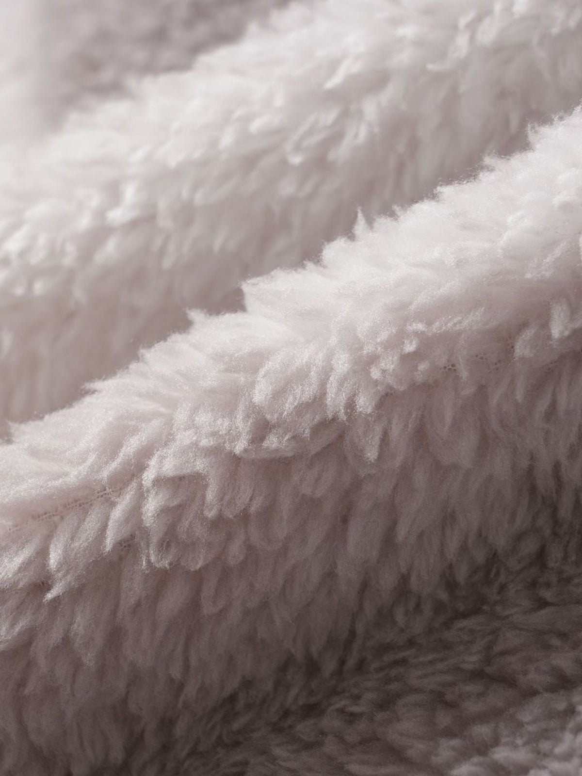 Classic men's plaid jacket with plush faux fur shoulder details, single pocket, buttons, and collar lapel