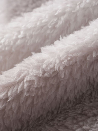 Classic men's plaid jacket with plush faux fur shoulder details, single pocket, buttons, and collar lapel