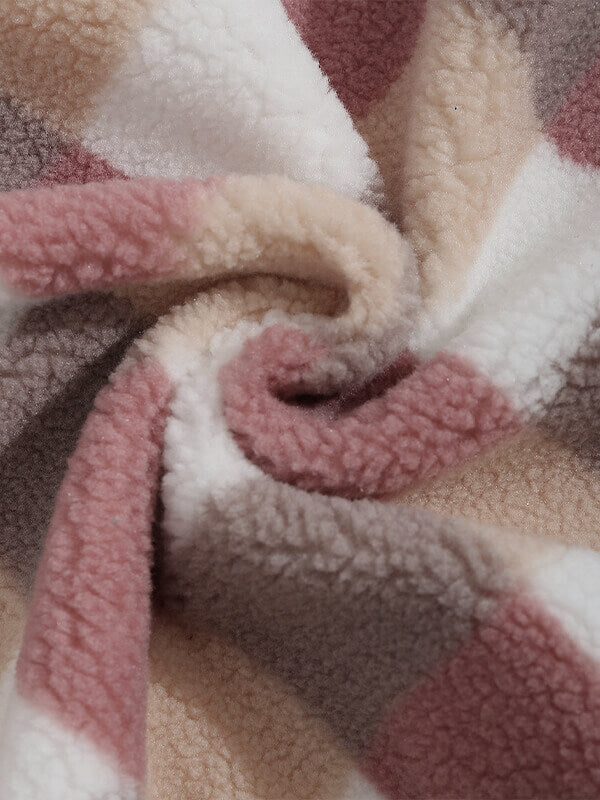 Classic men's plaid jacket with plush faux fur shoulder details, single pocket, buttons, and collar lapel