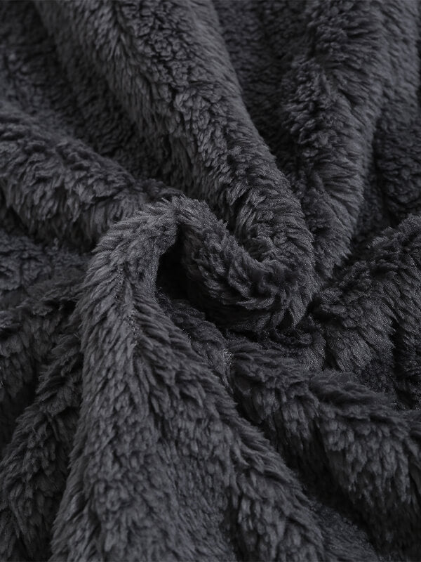 Classic men's plaid jacket with plush faux fur shoulder details, single pocket, buttons, and collar lapel