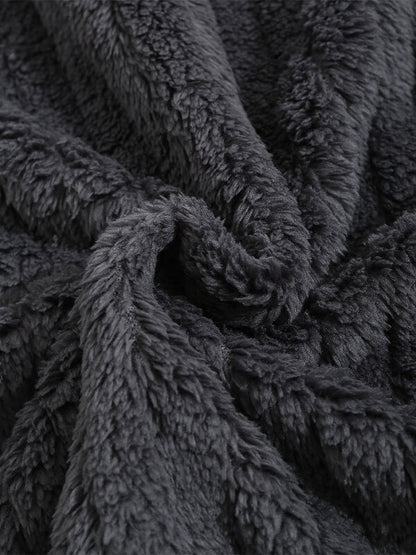 Classic men's plaid jacket with plush faux fur shoulder details, single pocket, buttons, and collar lapel